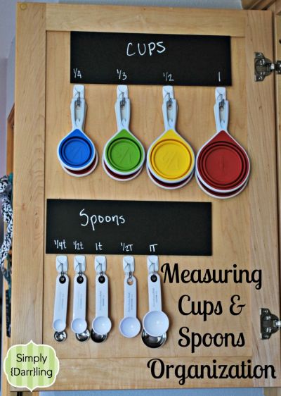 Use adhesive hooks to hang measuring cups and spoons inside a closet door
