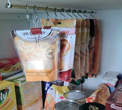 Combine hooks and a tension rod to store packages of food